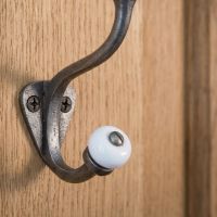 The Estate White Porcelain Knob Iron Coat Hook Showing a Close up of the Lower White Ceramic Hook - Digital Illustration
