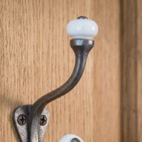 The Estate White Porcelain Knob Iron Coat Hook Showing a Close up of the Upper Ceramic Hook - Digital Illustration