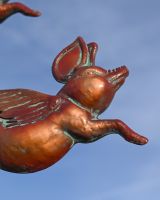 The Flight of Flying Pigs Verdigris Copper Weathervane Showing a Close up Shot of the Head of One of the Pigs