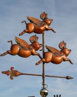 The Flight of Flying Pigs Verdigris Copper Weathervane Showing the Flying Pigs in the Sunlight