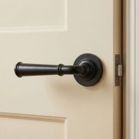 The Fulton Manor Beeswax Unsprung Lever Door Handle on Rose on a Cream Coloured Door in a modern Home - Digital Illustration