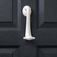 The Georgian Cameo Knocker in white on a Charcoal Grey Door shown Close up - Digital Illustration
