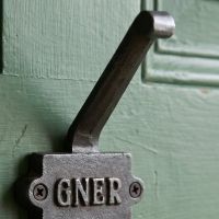 The GNER Railway Double Coat Hook in Cast Antique Iron Showing a Close up of the Top Hook - Digital Illustration