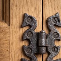 The Gothic Serpentine Butterfly Cabinet Hinge - 70mm Showing a Close up of the Decorative Backplates - Digital Illustration