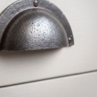 The Half-Moon Cast Antique Iron Cup Pull Handle - 110mm Showing a Close up of the Grip - Digital Illustration