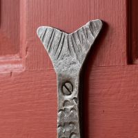 The Hand-Forged Fish Single Coat Hook - 110mm Showing a Close up of the Tail - Digital Illustration