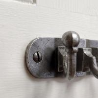 The Hawthorn Triple Coat Hook in Cast Antique Iron - 35 x 90mm Showing a Close up of the Rounded Hook - Digital Illustration