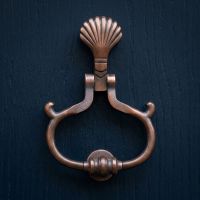 The Hermoso Beach Antique Copper Sea Shell Door Knocker on a Navy Blue Timber Door of a Period Home - Digital Illustration