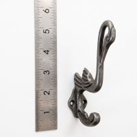 The Heron Cast Antique Iron Hat and Coat Hook On a White Background  next to a Ruler - Digital Illustration