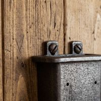 The Inn Cast Iron Bottle Cap Catcher Showing the Screw attachments