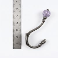 The Ironmonger Acorn Purple Ceramic Coat Hook - 125mm On a White Background  with a Ruler for Scale - Digital Illustration