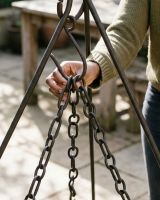 The Kadai Cooking Bowl with Hanging Chains Showing a Close up of the Chain being Attached to a Tripod Hook - Digital Illustration