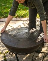 The Kadai Fire Bowl Shield and Snuffer Lid Showing a Person Lowering the Lid onto a Fire Bowl - Digital Illustration