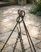 The Kadai Hanging Stone BBQ Griddle Plate Showing a Close up of the Chains attached to a Tripod Hook - Digital Illustration