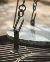 The Kadai Hanging Stone BBQ Griddle Plate Showing a Close up of the Hooks that Attach the Chains - Digital Illustration