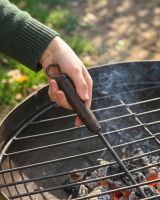 The Kadai Iron Grill Lifter with Hardwood Handle Showing a Close up of the Wooden Handle - Digital Illustration