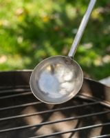 The Kadai Long-Handled Iron Cooking Ladle with Wooden Grip Showing a Close up of the Scoop - Digital Illustration