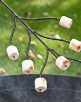 The Kadai Marshmallow Roasting Branch with Wooden Handle Showing a Close up of Marshmallows Cooking on the Prongs - Digital Illustration