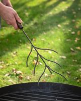 The Kadai Marshmallow Roasting Branch with Wooden Handle with a Hand in Shot for Scale - Digital Illustration