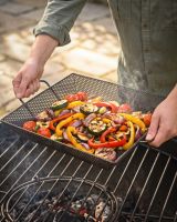 The Kadai Mesh BBQ Grill Tray with Hands in Shot for Scale - Digital Illustration