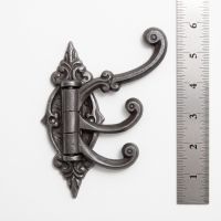 The Kensington Swivel Triple Arm Coat Hook on a White Background next to a Steel Ruler for Scale - Digital Illustration