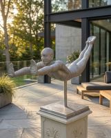 The Leap of Faith Contemporary Garden Statue Shown on. a Patio Outside a Contemporary Home - Digital Illustration