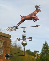 The Leaping Stag Verdigris Copper Weathervane Shown Mounted onto a Brick wall