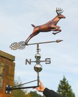 The Leaping Stag Verdigris Copper Weathervane Shown with Hand in Shot for Scale