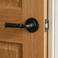 The Manning House Beeswax Rounded Unsprung Lever Door Handle on Rose Mounted on a Timber Door in a Modern Home - Digital Illustration