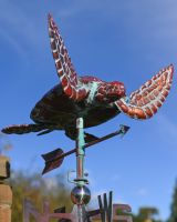 The Mariner’s Reach Sea Turtle Verdigris Copper Weathervane Shown Looking up at the Turtle with a Blue Sky Behind
