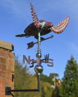 The Mariner’s Reach Sea Turtle Verdigris Copper Weathervane Shown Mounted onto the side of a Building