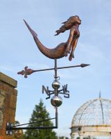 The Maritime Mermaid Verdigris Copper Weathervane Showing a Full View Mounted on a Wall