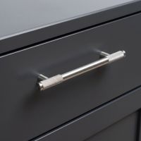 The Medium Half Knurled Cabinet Pull Handle in Satin Stainless Steel on a Grey Set of Wooden Drawers in a Kitchen Interior - Digital Illustration