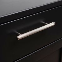 The Medium Knurled Cabinet Pull Handle in Polished Stainless Steel On a Black Set of Drawers in a Modern Home - Digital Illustration