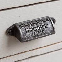 The Portobello Antique Iron Cup Pull Handle 98mm Shown on a Set of Grey Drawers - Digital Illustration