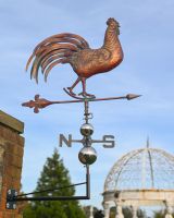 The Proud Cockerel Verdigris Copper Weathervane Shown form the Side Mounted on a Garden Wall