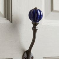 The Regency Navy Ceramic Top Cast Iron Wall Hook Showing a Close up of the Blue Ceramic Finial - Digital Illustration
