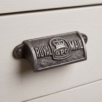 The Royal Mail GPO Cast Antique Iron Cup Pull Handle - 4" Shown on a Grey Set of Drawers - Digital Illustration