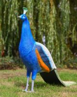 The Sandringham Cast Aluminium Peacock Garden Sculpture Shown on a Grassy Lawn in the Sun