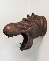 The Savannah the Hippo Wall Sculpture Shown From the Side on a White Wall