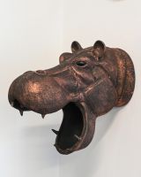The Savannah the Hippo Wall Sculpture Shown on a White Wall at an Angle