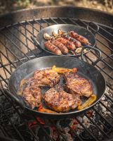 The Set of 3 Kadai Iron BBQ Skillet Pan Set Shown with Some Food Sizzling on the Large and Medium Skillet - Digital Illustration