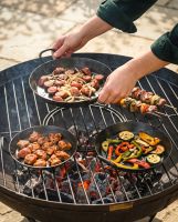 The Set of 3 Kadai Iron BBQ Skillet Pan Set Shown with a Selection of BBQ Food Cooking on Each Skillet - Digital Illustration