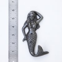 The Siren Mermaid Cast Antique Iron Wall Coat Hook - 145mm on a White Background next to a Steel Ruler for Scale - Digital Illustration
