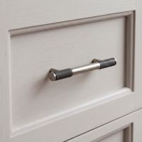 The Small Half Knurled Cabinet Pull Handle in Pewter on a Cream Coloured Wooden Kitchen Drawer - Digital Illustration