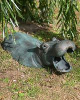 The Small Zambezi Submerged Hippo Garden Sculpture Showing the Sculpture on a Grassy Garden Lawn under a Tree