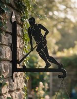 The Steel Female Hockey Player Hanging Basket Bracket on a Stone Wall in a Low Walled Country Garden - Digital Illustration