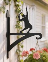 The Steel Male Tennis Player Hanging Basket Bracket on a White Picket Fence next to a WHite Shed - Digital Illustration