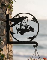 The Steel Microlight Hanging Basket Bracket on a Coastal Home overlooking the Sea - Digital Illustration