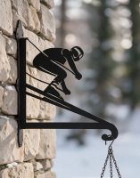 The Steel Skiing Hanging Basket Bracket on a Brick Wall in a Wintery Garden Scene - Digital Illustration